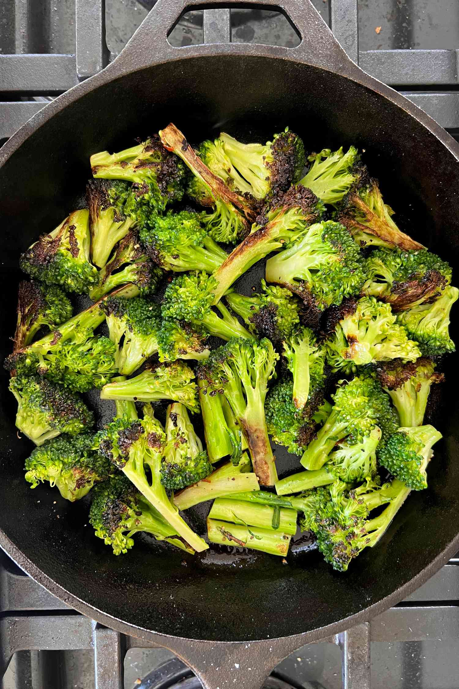 Charred broccoli on a cast iron skillet