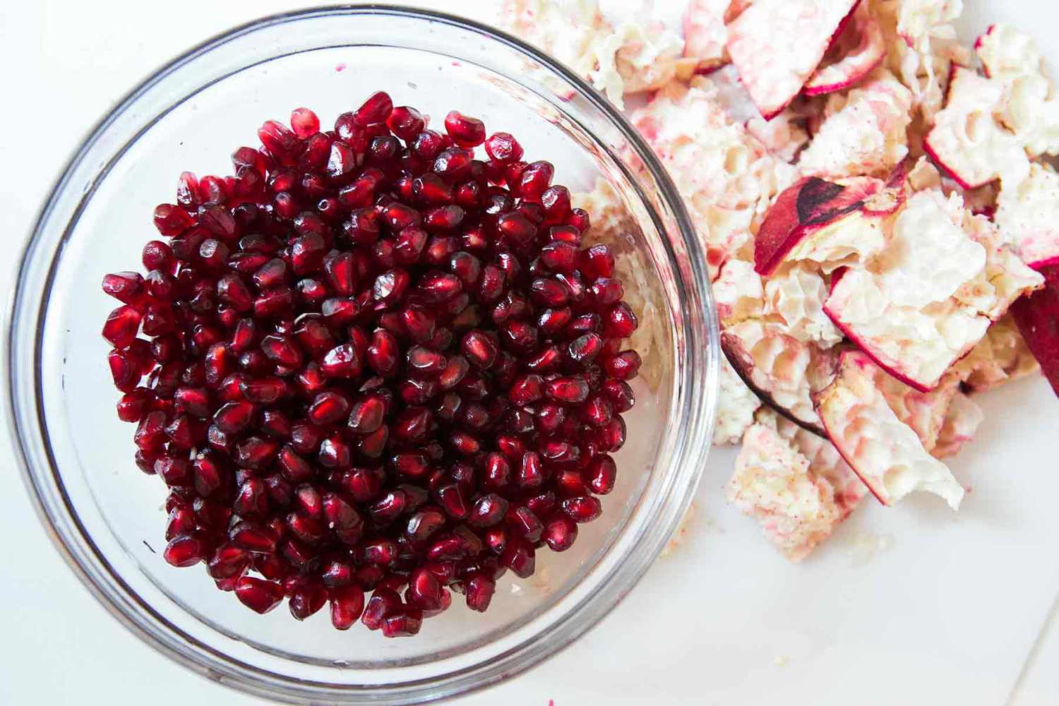 how to eat a pomegranate - a bowl full of pomegranate seeds