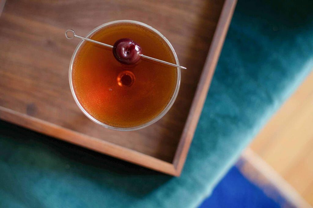 Manhattan cocktail ingredients rye whiskey, sweet vermouth, and angostura bitters