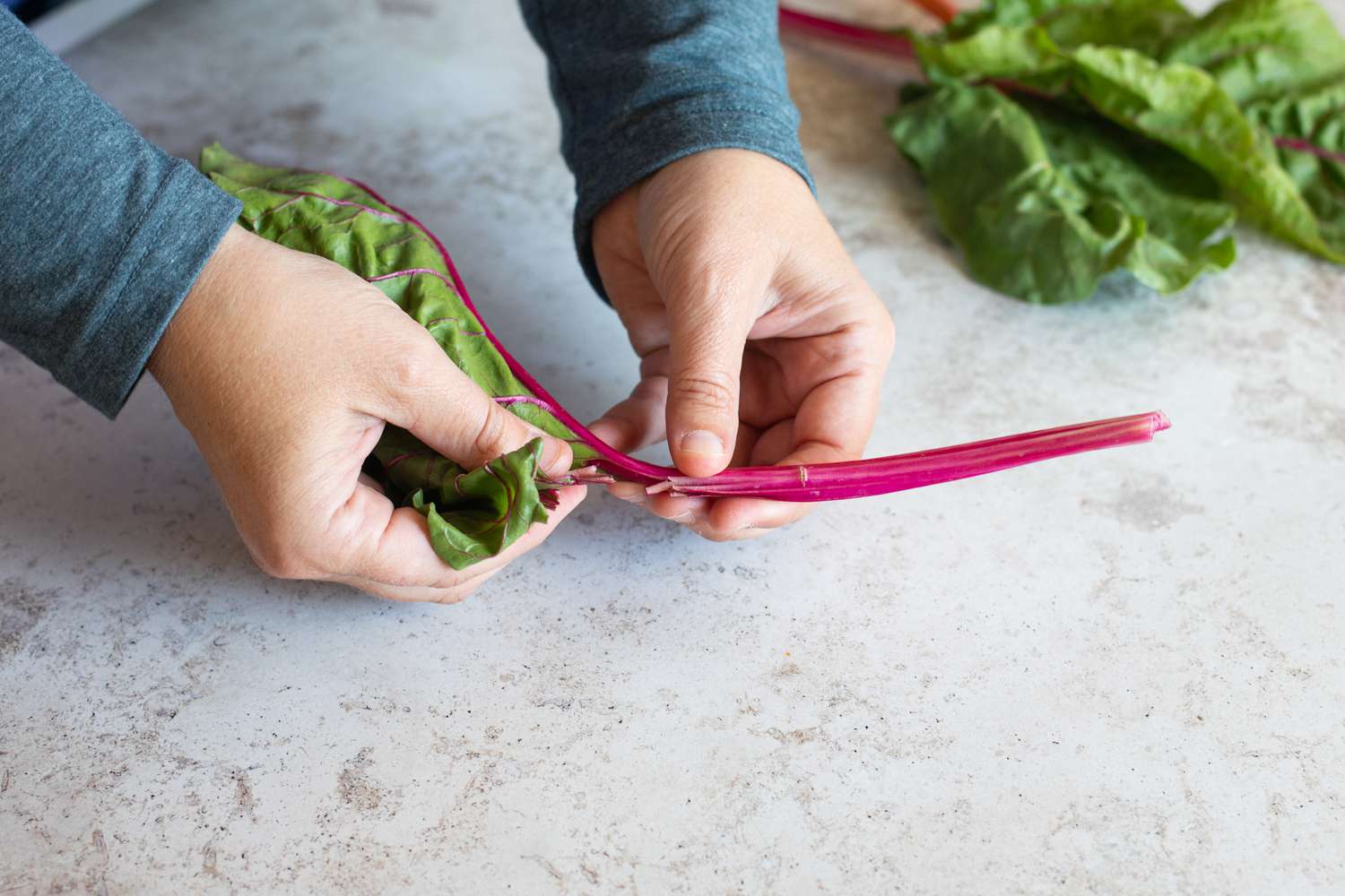 Tear chard leaves away from the red stem