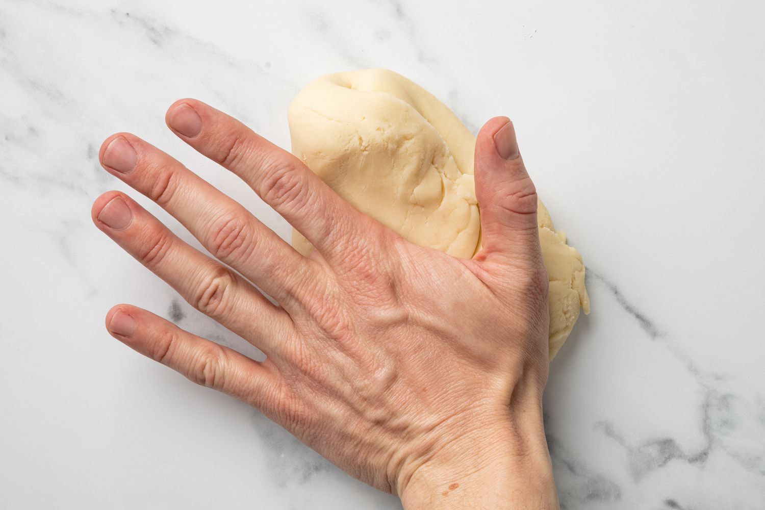 Hand Kneading Marzipan on Counter
