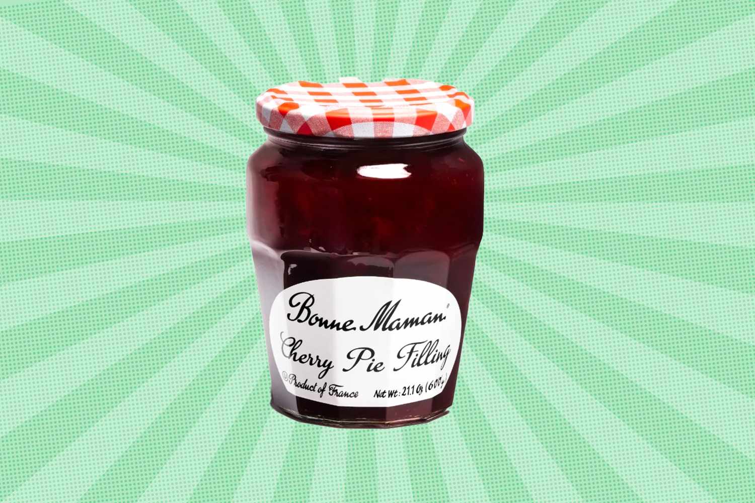 Bonne Maman cherry pie filling jar on a patterned background