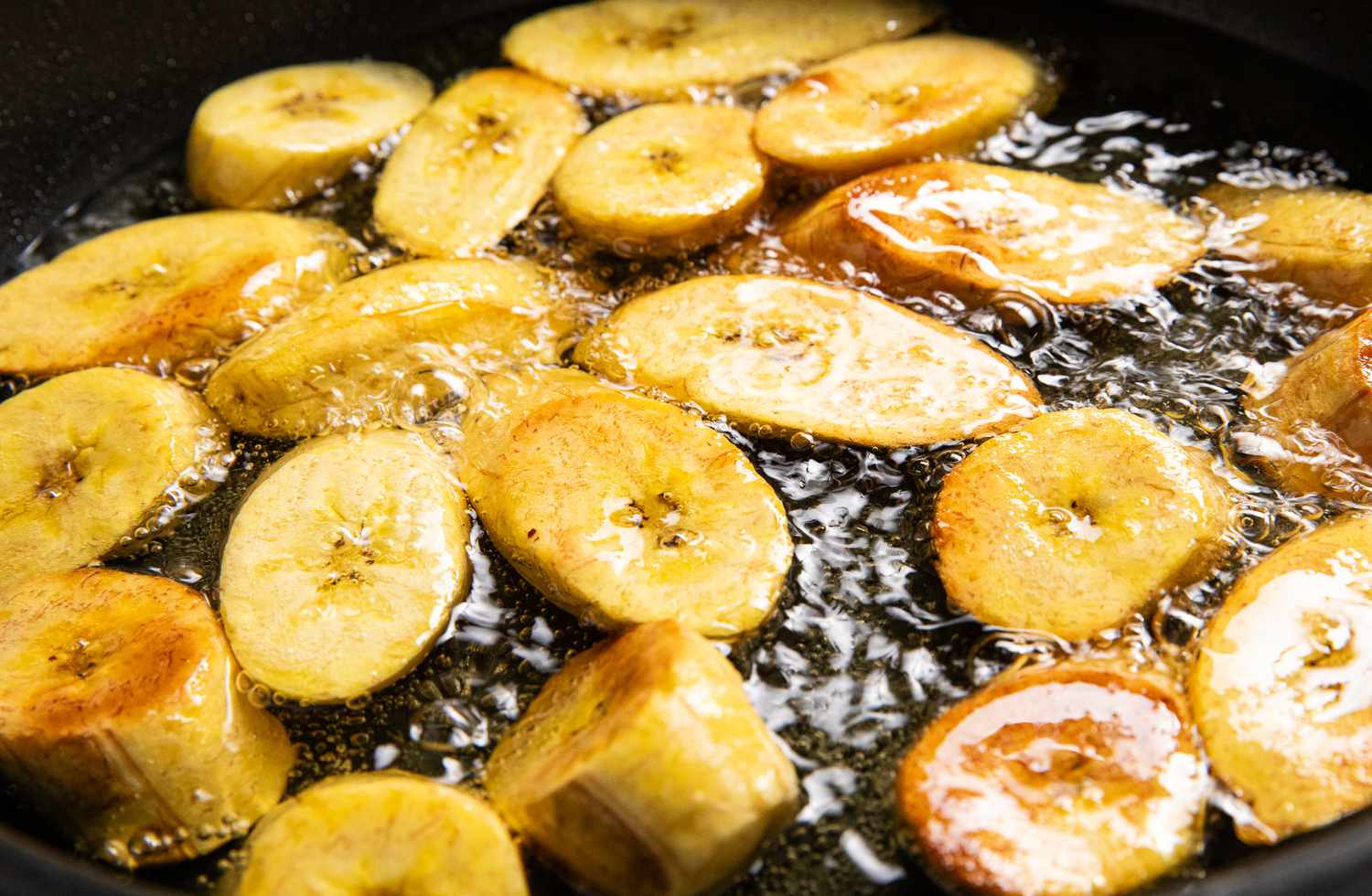 Maduros Frying in a Pot of Oil