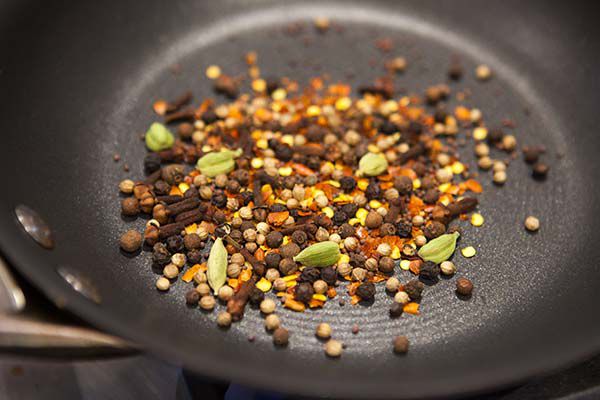 Herbs and spices heating up on a pan