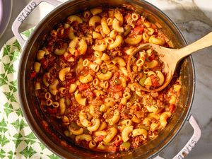 overhead view of a pot of American Chop Suey with a ladle