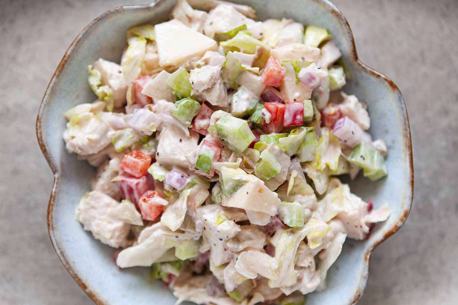 Chicken Salad with celery and bell pepper in a serving bowl
