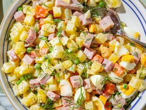 bowl of olivier potato salad on a table