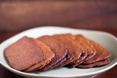 A plate of thin and crispy gingersnap cookies