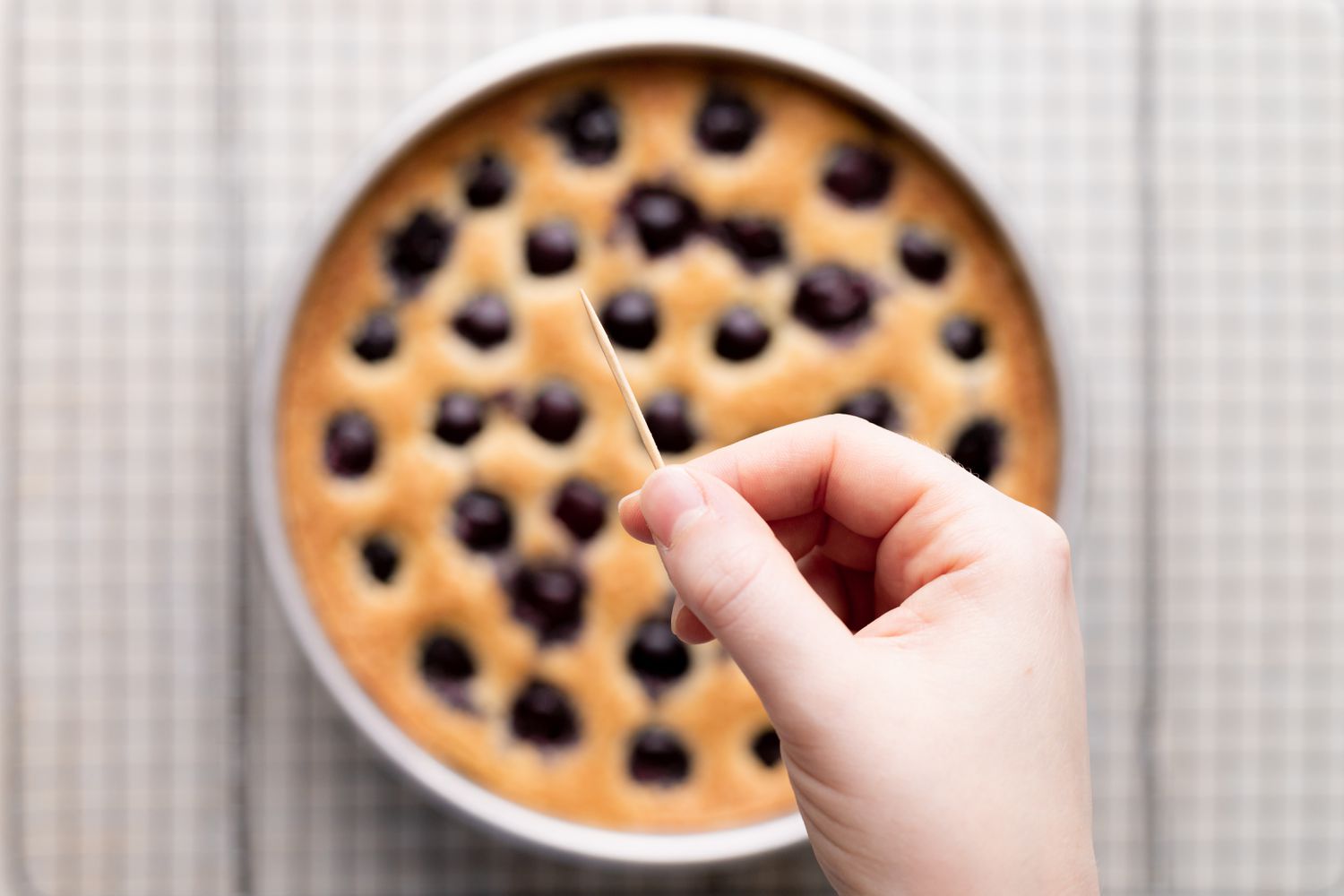 Cherry cake from scratch cooling on a wire rack.