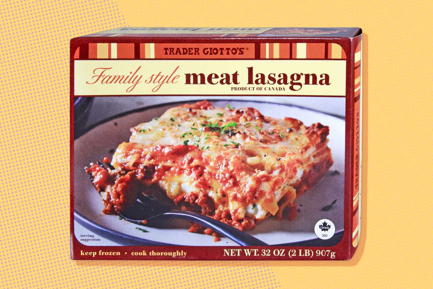 Box of Trader Joe's Family Style Meat Lasagna, showing a prepared slice on the packaging