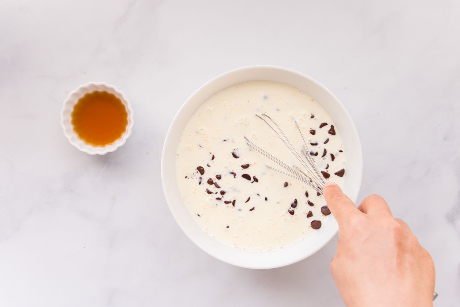 Combining butter, chocolate chips, and cream to make a perfect chocolate ganache recipe