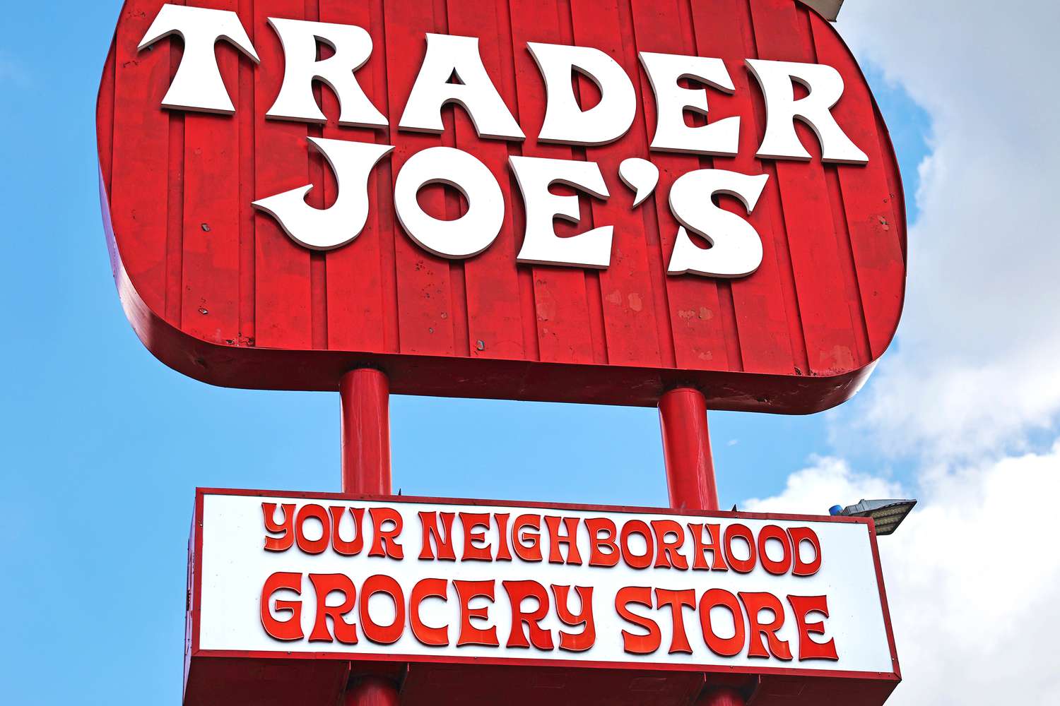 Trader Joe's store sign, text displaying branding and slogan