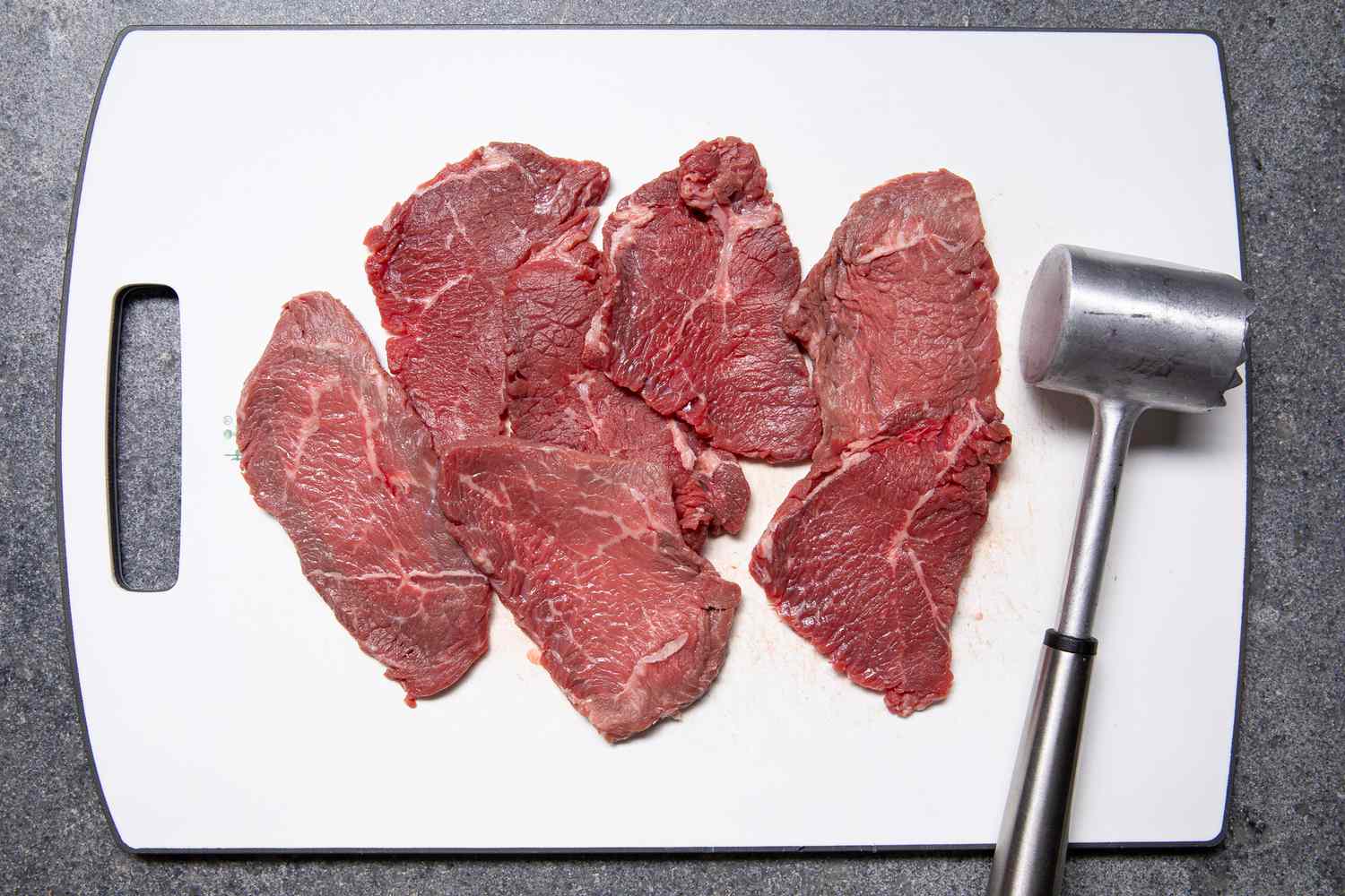 Beef Slices Tenderized Using a Meat Tenderizer for Bistek Recipe