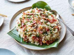 Vietnamese steamed rice served over banana leaves.