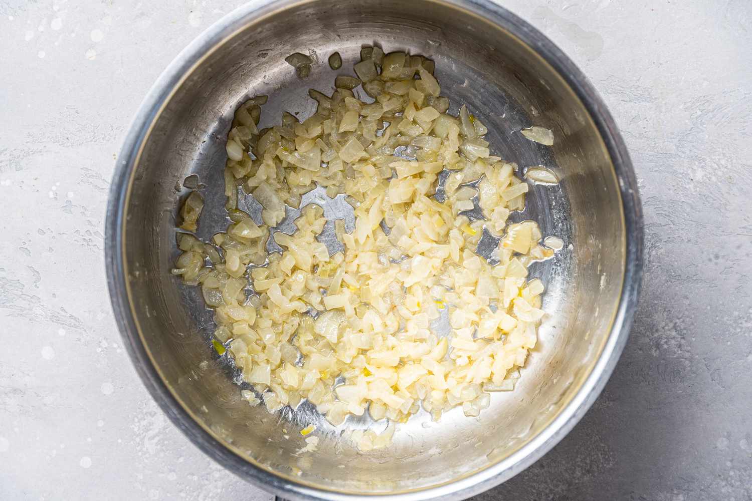 Cooking onions in a pot to make Cream of Spinach Soup
