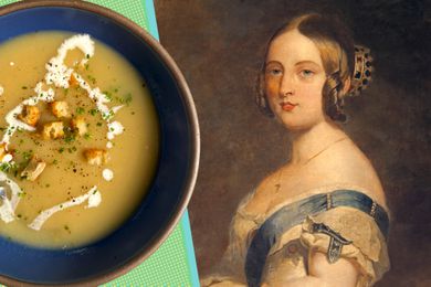 A painting of Queen Victoria next to a bowl of soup topped with croutons and a drizzle of cream