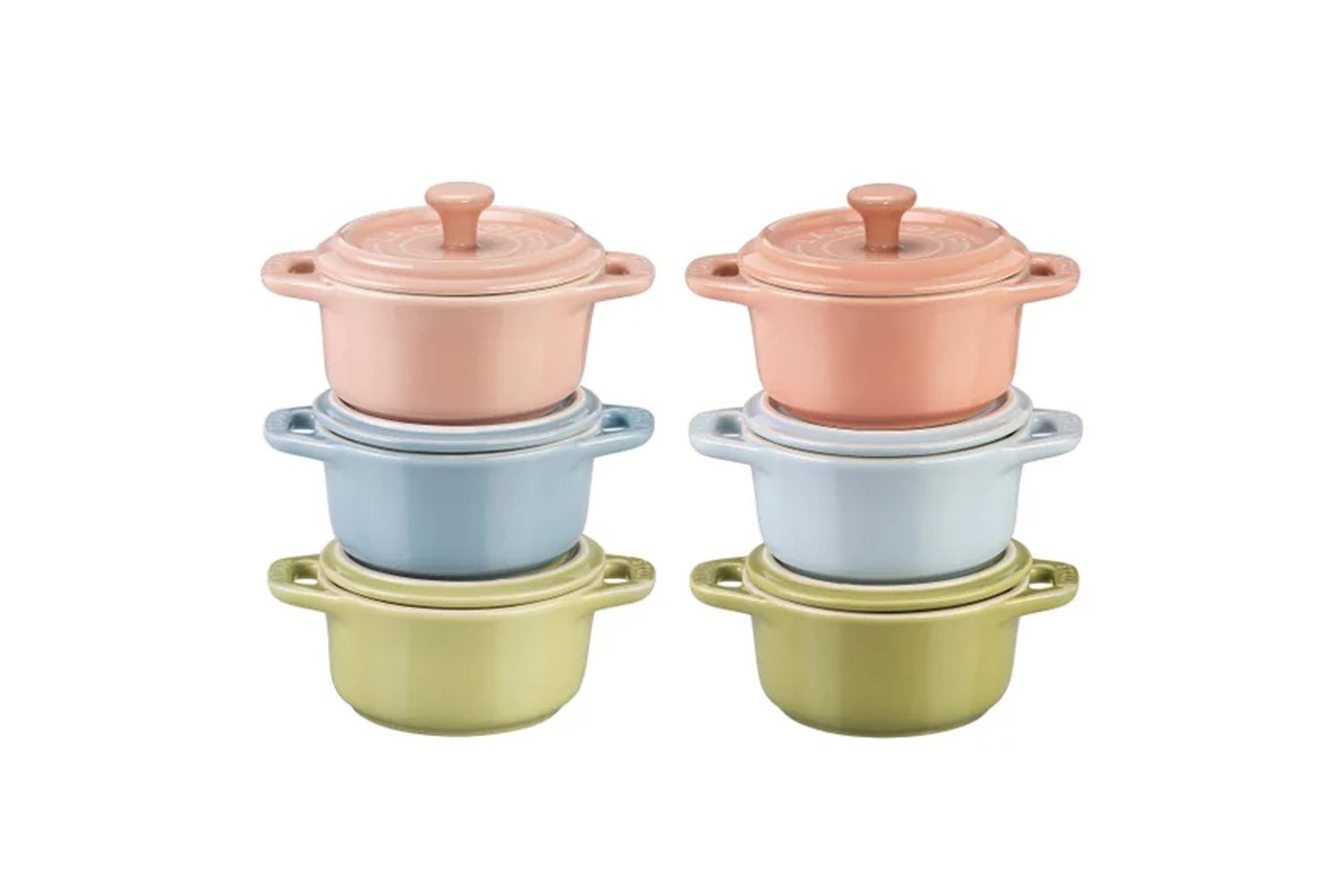 Four miniature cookware pots in pairs organized in pastel colors of pink blue and green