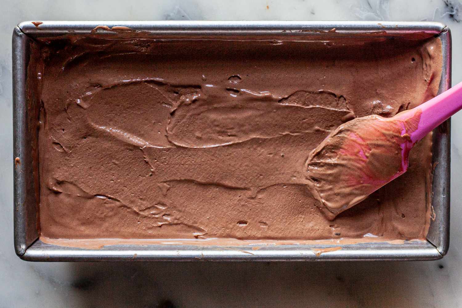 Freezing mexican hot chocolate recipe in a loaf pan for ice cream.