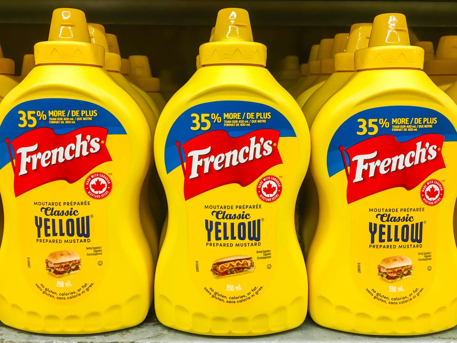 French's Yellow Mustard bottles on a store shelf