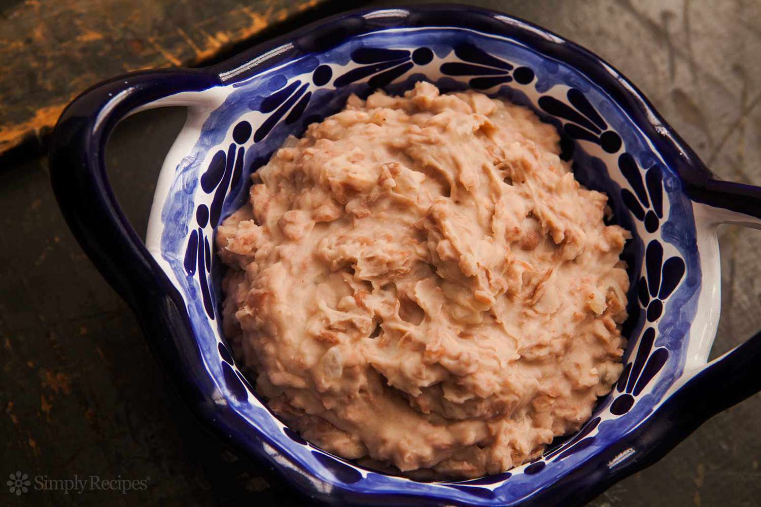 Refried Beans resting in a blue Bowl