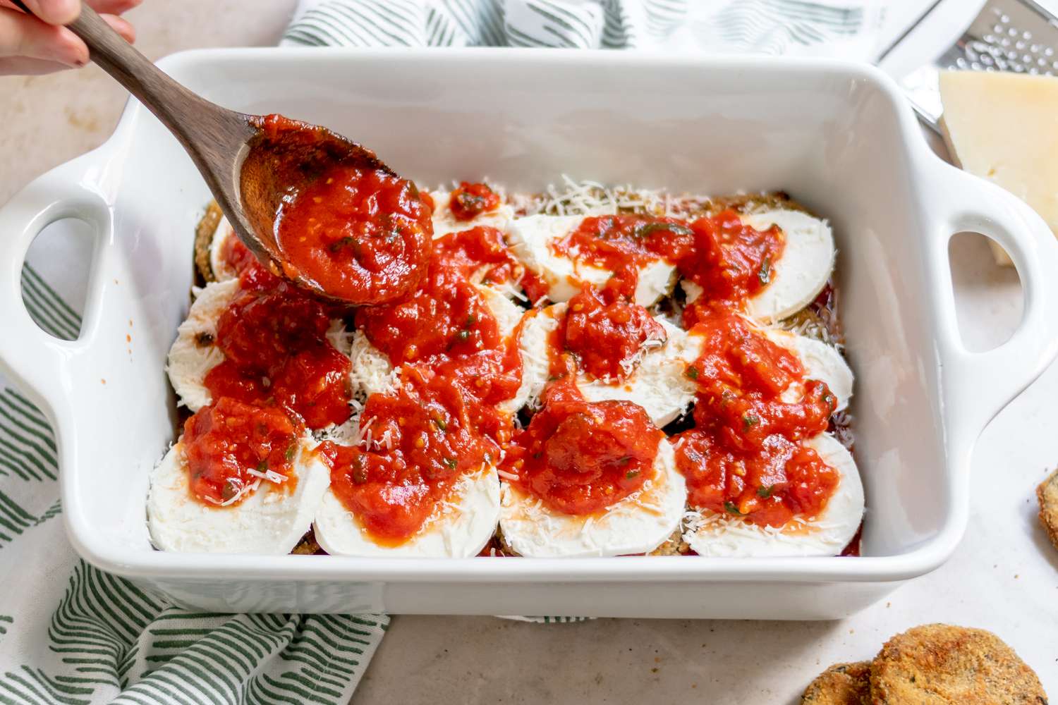 Adding tomato sauce to a casserole dish
