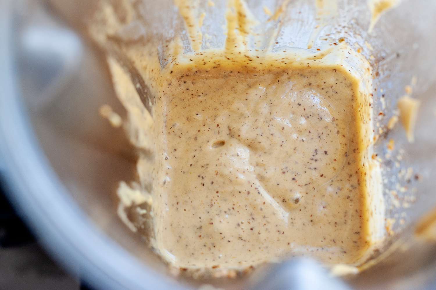 Blender with homemade honey mustard inside.