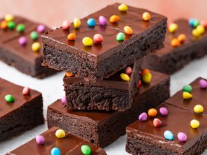 Stack of Homemade Cosmic Brownies and more on the counter around it