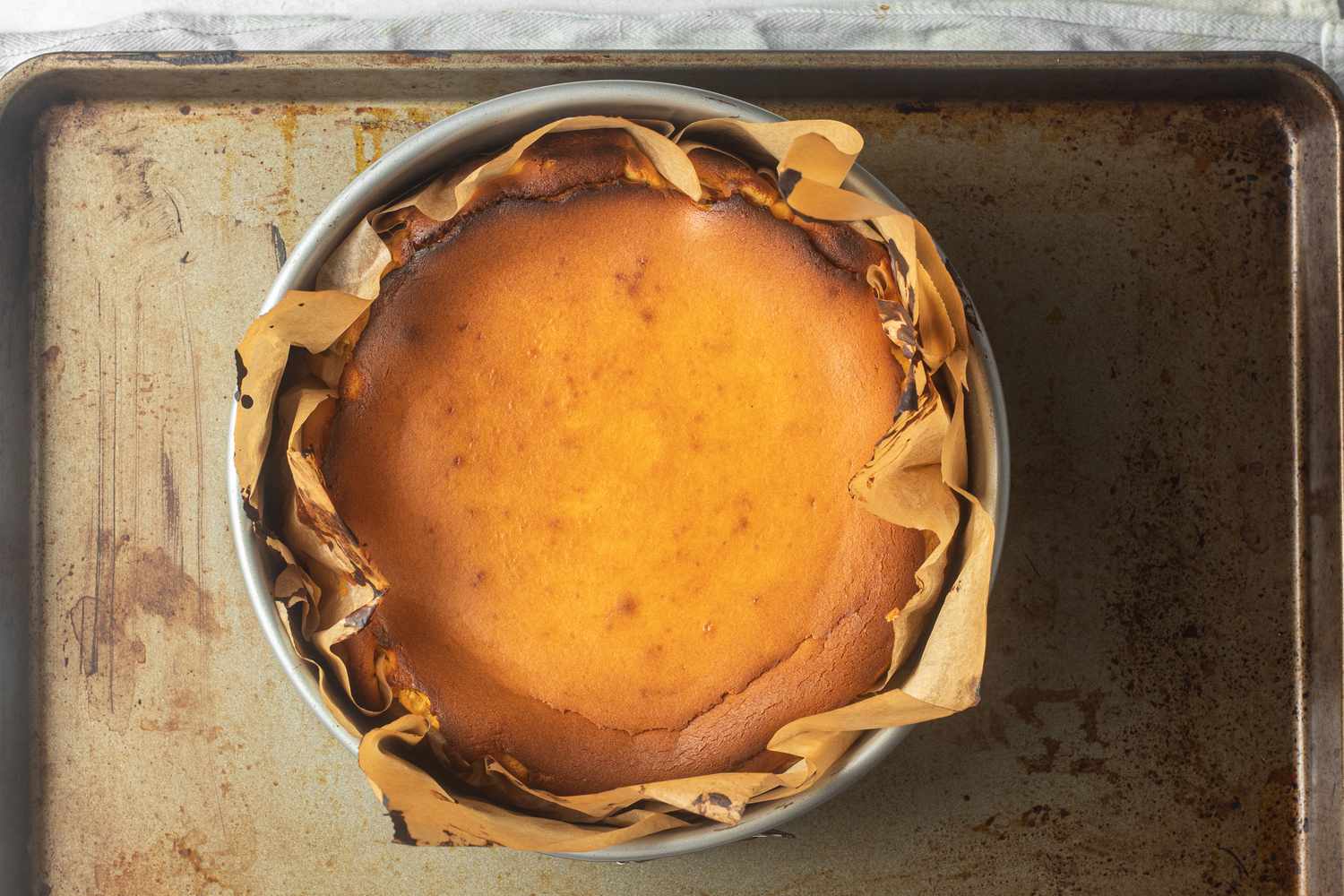 Overhead view of a baked basque cheesecake.