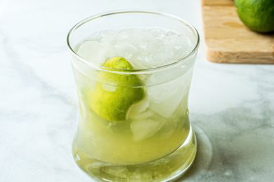A rocks glass with a Brazilian caipirinha inside.