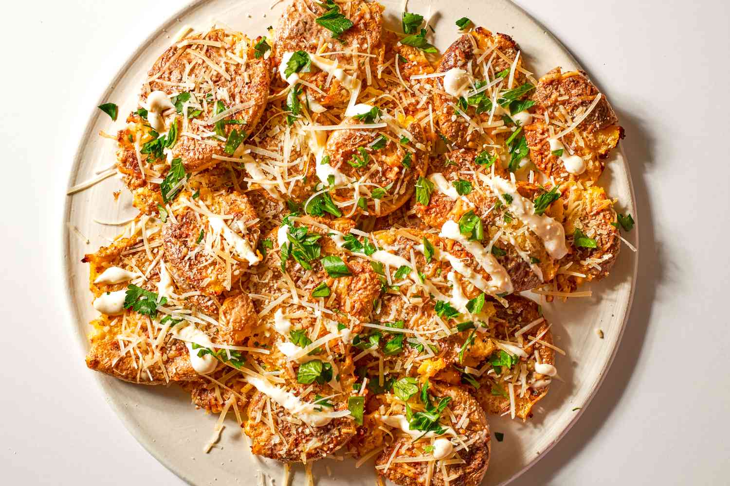 Crispy Caesar Smashed Potatoes on a platter