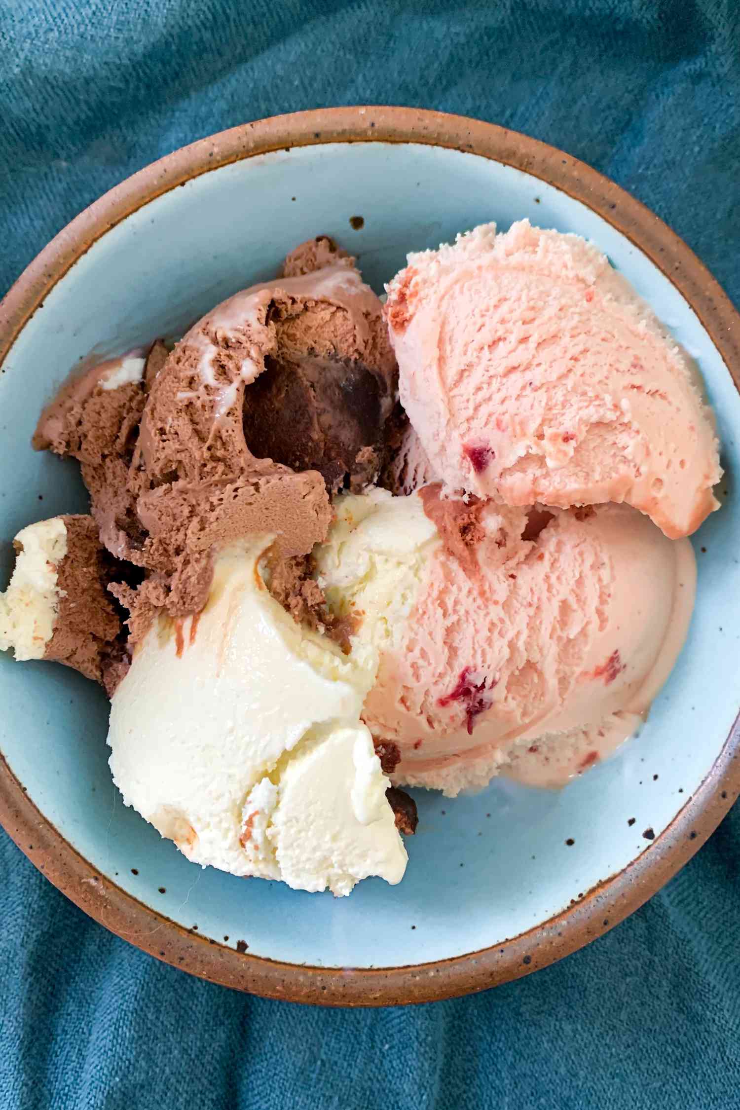 Tillamook Neopolitan ice cream scooped into a blue bowl