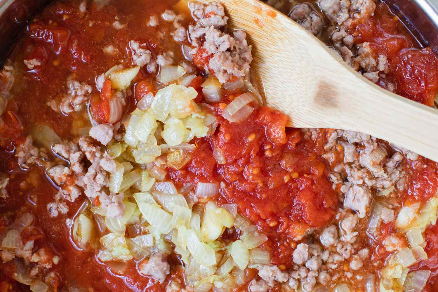 Making Easy Italian Sausage Spaghetti in a pan
