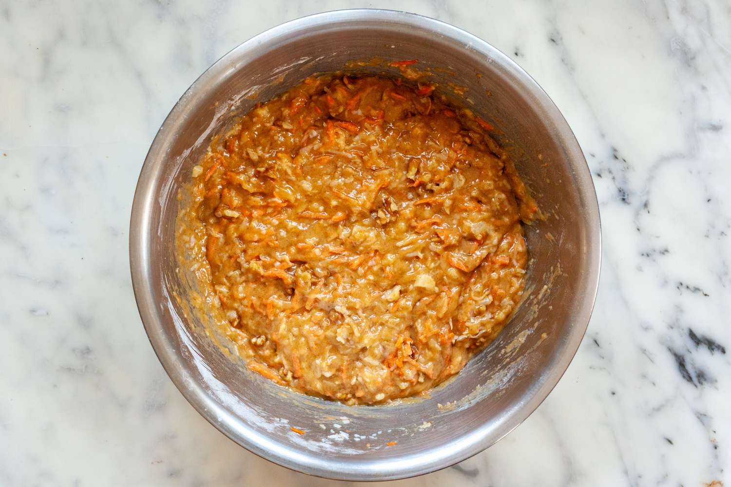 Batter in a bowl for an easy carrot cake recipe.
