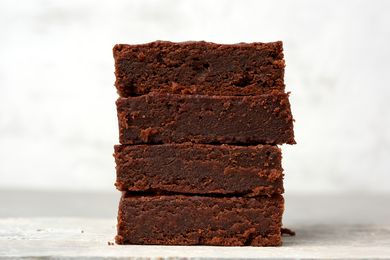 Side view of four brownies stacked on top of eachother