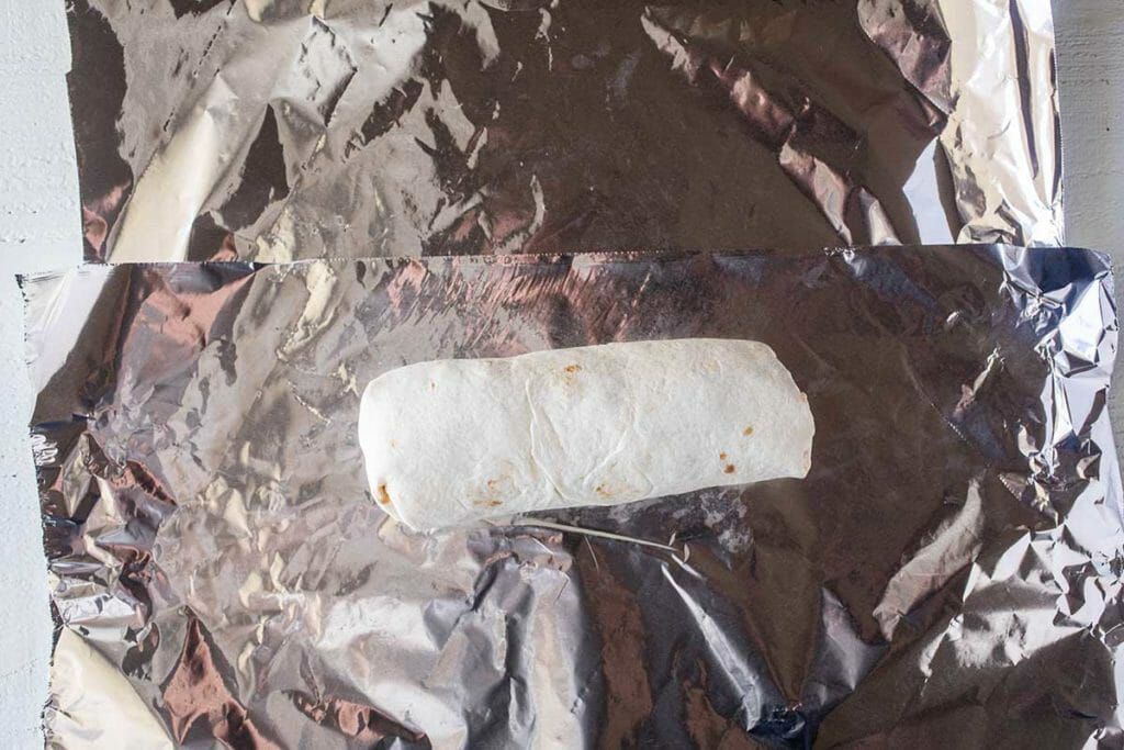 Wrap chicken freezer burritos in heavy duty aluminum foil