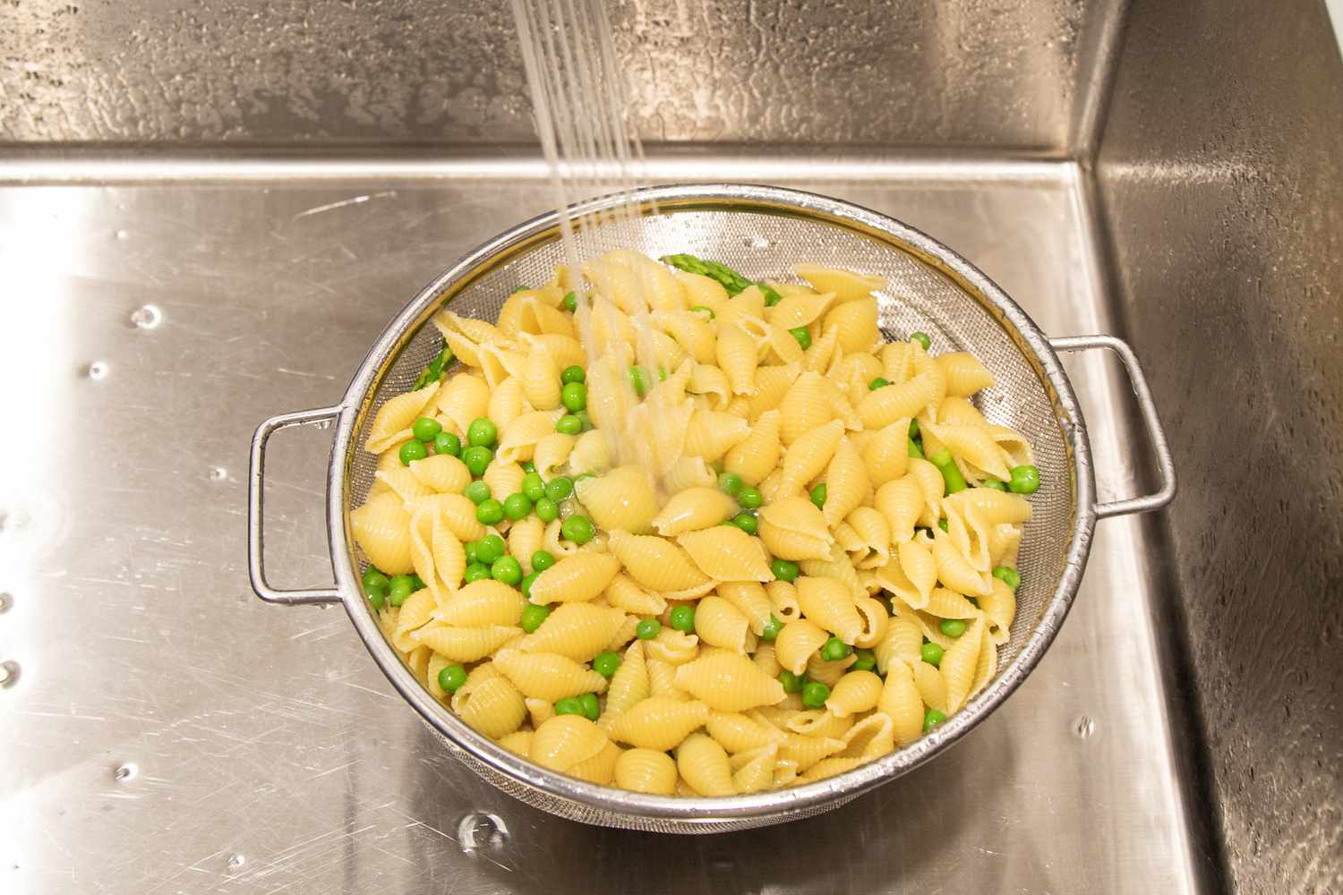 Rinse Colander with Pasta and Vegetables for Green Goddess Salad