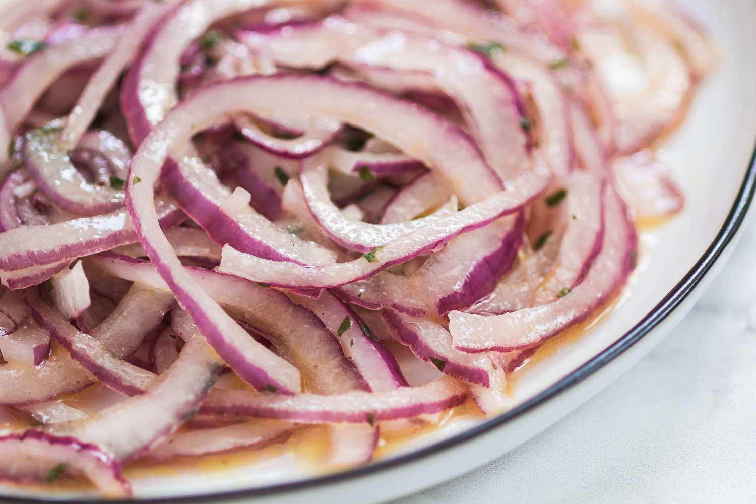 Sliced red onions to make a tuna nicoise.