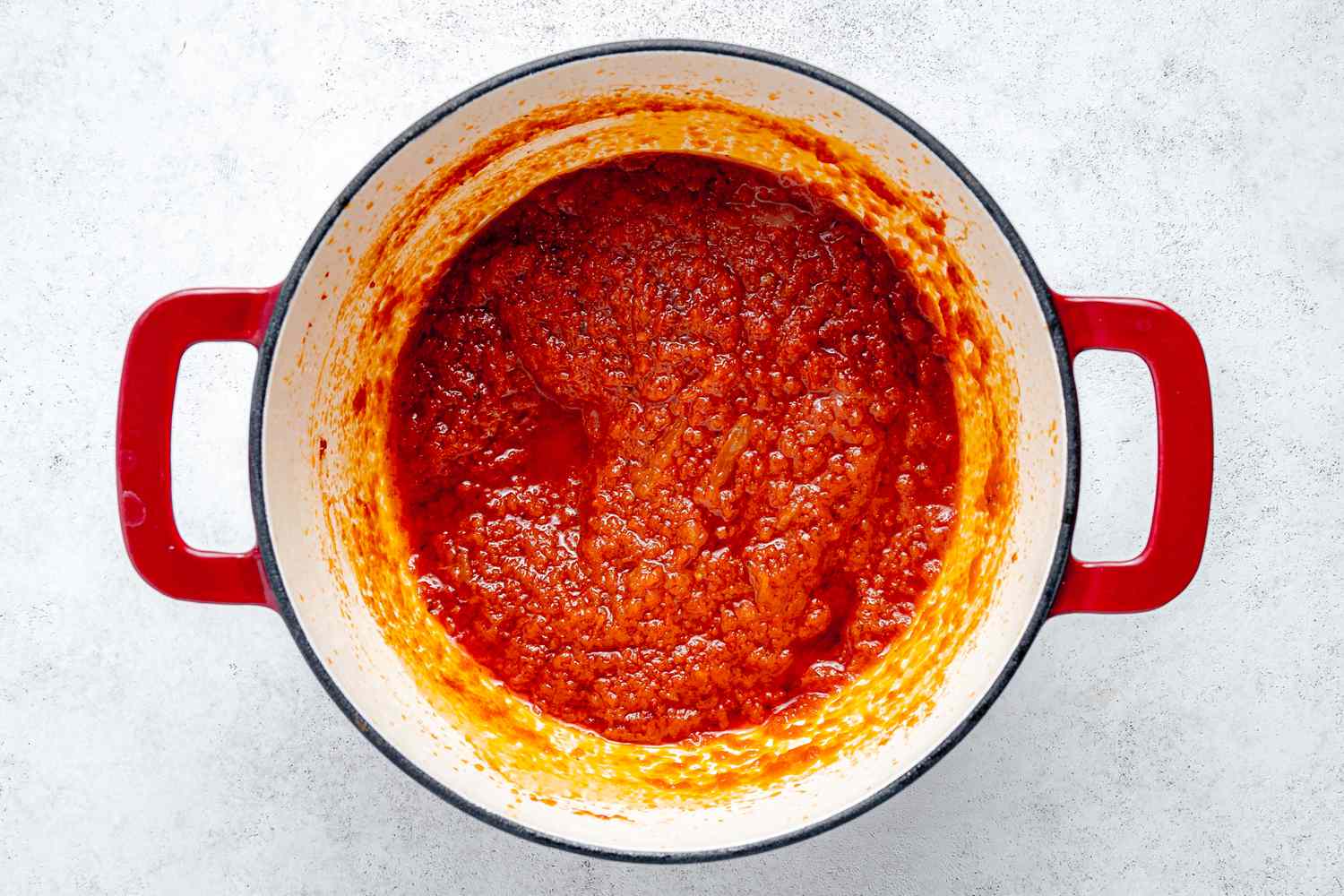 Stew Base Reduced to a Paste-Like Consistency in the Dutch Oven 