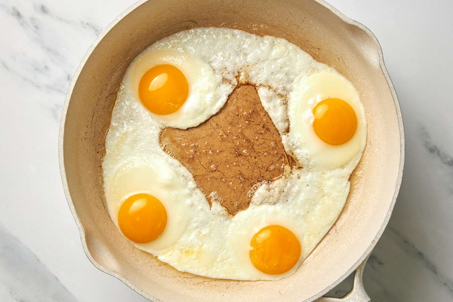 Four Sunny Side Eggs Fried on a Skillet for Huevos Rancheros Recipe