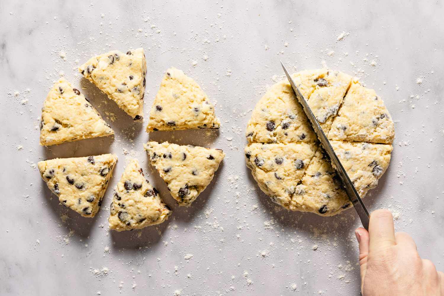 Scones being cut into triangles before baking for Chocolate Chip Scones recipe