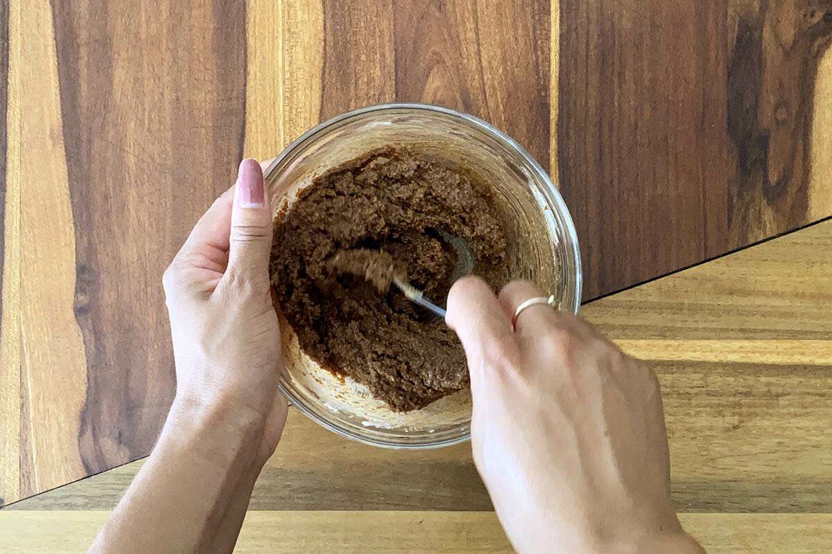 Cinnamon filling for Easy Gluten Free Cinnamon Rolls is mixed in a small bowl.