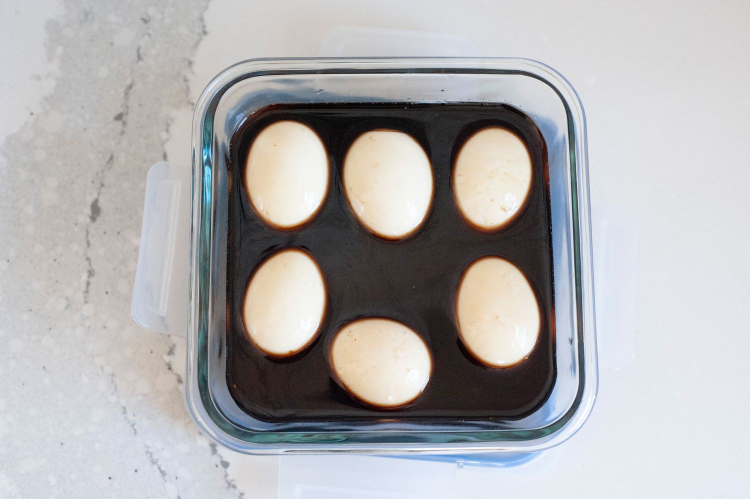 Eggs in Container of Soy Sauce Marinade 