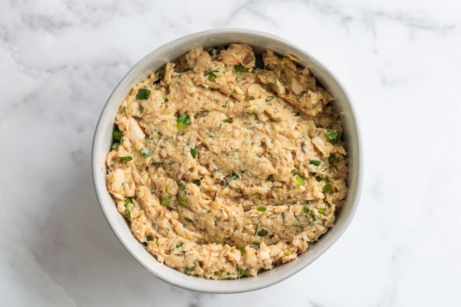 How to make salmon patties with the mixture in a bowl.
