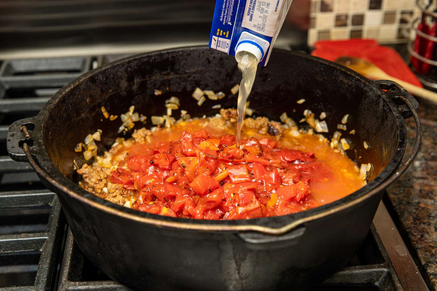 Tomatoes and Stock Added to the Pot 