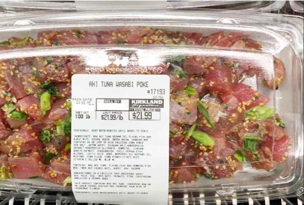 Packaged ahi tuna wasabi poke with a visible price label from Costco in a clear plastic container