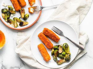 Sheet Pan Buffalo Tofu and Blue Cheese Brussels Sprouts on Two Plates