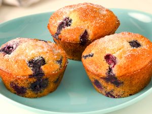 3 blueberry muffins on a small plate