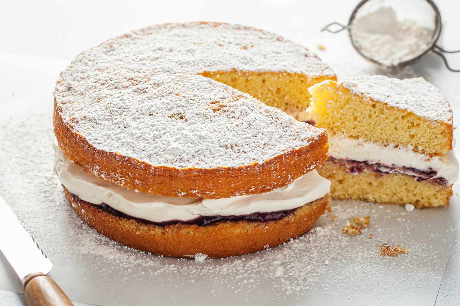 Victoria Sponge Cake with a Slice Cut Out