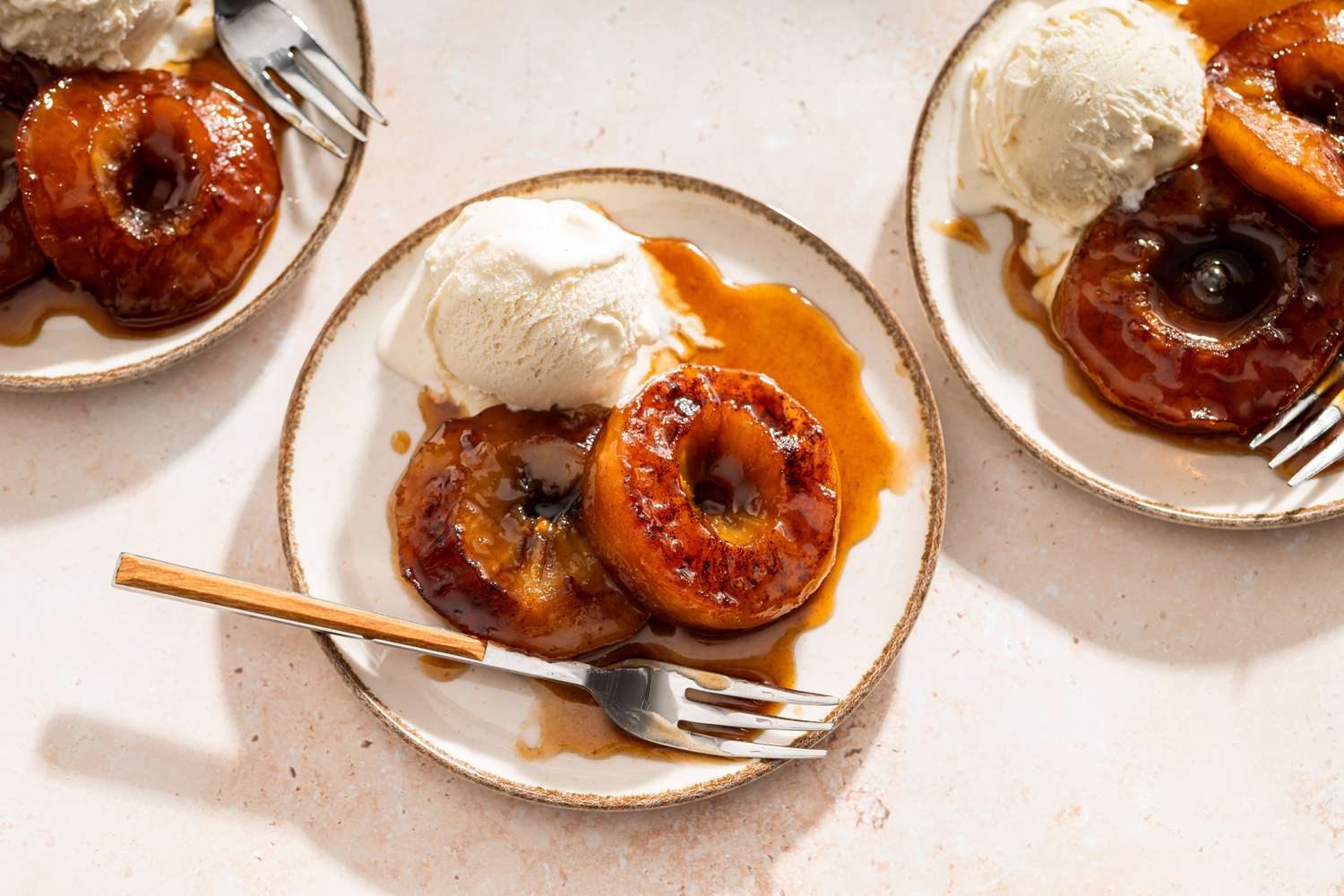 Melting Apples on a small dessert plate with a scoop of vanilla ice cream