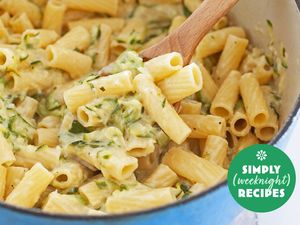 A pot of cooked pasta with creamy sauce and garnished with herbs from Simply Recipes